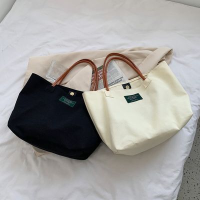 Dernière mode Logo personnalisé toile Poche grande capacité étudiant sac à main unique