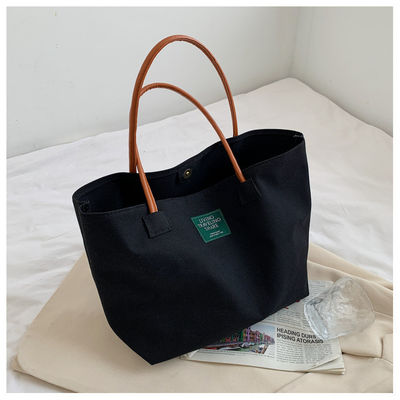 Dernière mode Logo personnalisé toile Poche grande capacité étudiant sac à main unique