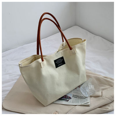 Dernière mode Logo personnalisé toile Poche grande capacité étudiant sac à main unique