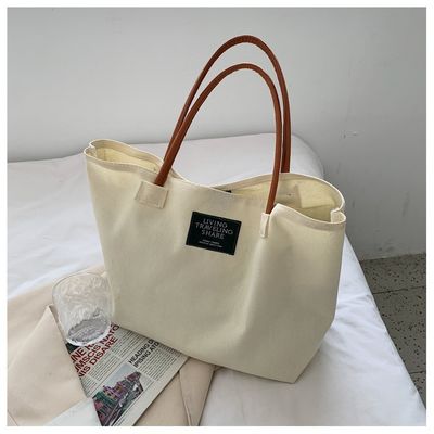 Dernière mode Logo personnalisé toile Poche grande capacité étudiant sac à main unique