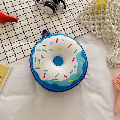 Nouveauté Sac à livres mignon 2024 Sac à dos dessin animé Donuts Sac scolaire en caoutchouc pour la vie quotidienne