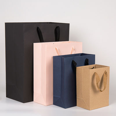 Logo imprimé personnalisé Boutique de luxe Boutique de magasinage Sacs-cadeaux en papier Emballage cadeau personnalisé