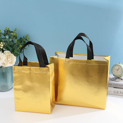 Sac de magasinage laminé non tissé de couleur personnalisée avec couleur dorée et longueur de poignée