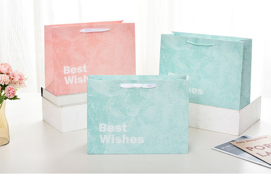 Logo imprimé personnalisé Boutique de luxe Sacs-cadeaux en papier pour emballage