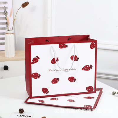 Sac de magasinage imprimé sur mesure en carton Sac cadeau en papier kraft blanc de luxe avec poignée de ruban