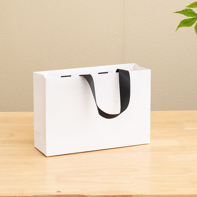 Sacs en papier imprimé sur mesure Carton Sac cadeau en papier kraft blanc de luxe pour sac de magasinage