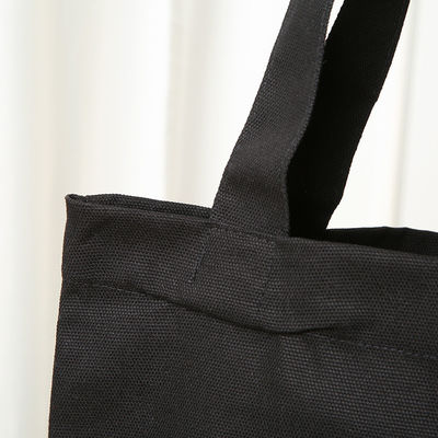 Sac à dos en coton noir écologique avec logo imprimé sur mesure