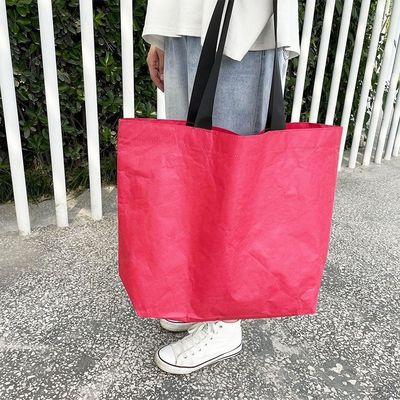 Sac de magasinage en papier Dupont en couleur personnalisée avec un matériau imperméable et lavable