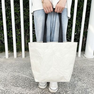Sac de magasinage en papier Dupont en couleur personnalisée avec un matériau imperméable et lavable