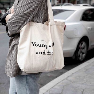 Sacs à dos en coton de couleur personnalisés avec style manipulé et logo de l'entreprise imprimé