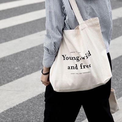 Sacs à dos en coton de couleur personnalisés avec style manipulé et logo de l'entreprise imprimé