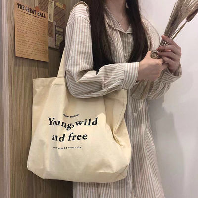 Sacs à dos en coton de couleur personnalisés avec style manipulé et logo de l'entreprise imprimé
