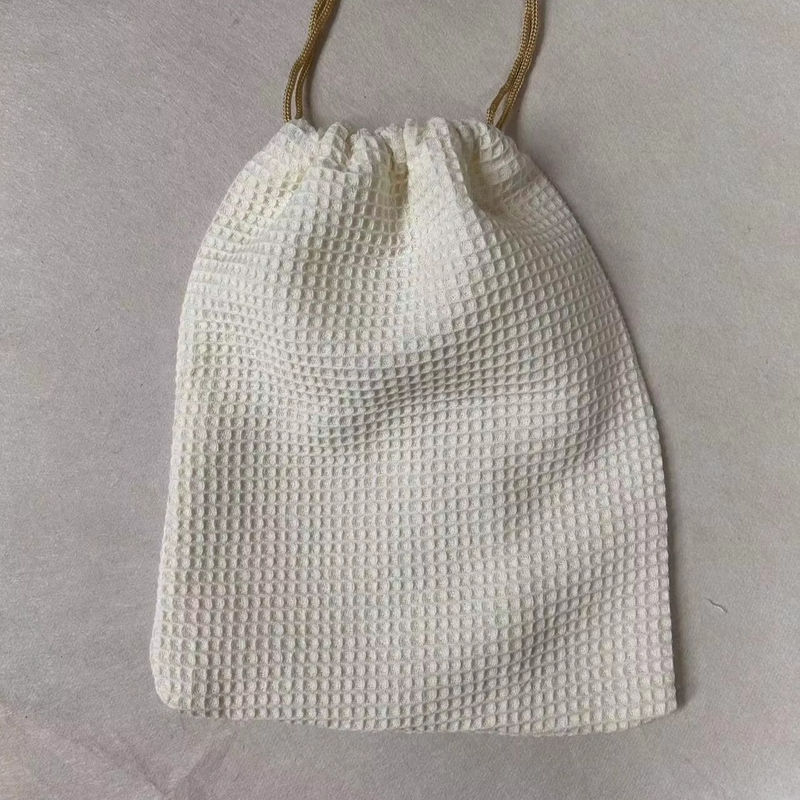 Produit OEM/ODM Accepté Sac de stockage cosmétique en tissu de gaufre vierge pour les besoins de soins de la peau