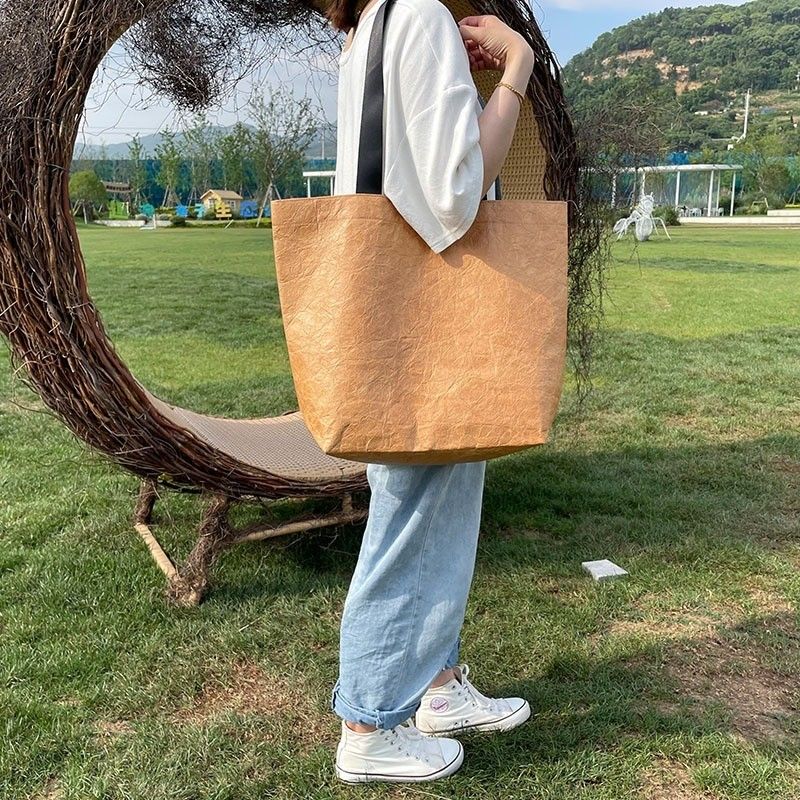 Sac de magasinage en papier Dupont en couleur personnalisée avec un matériau imperméable et lavable