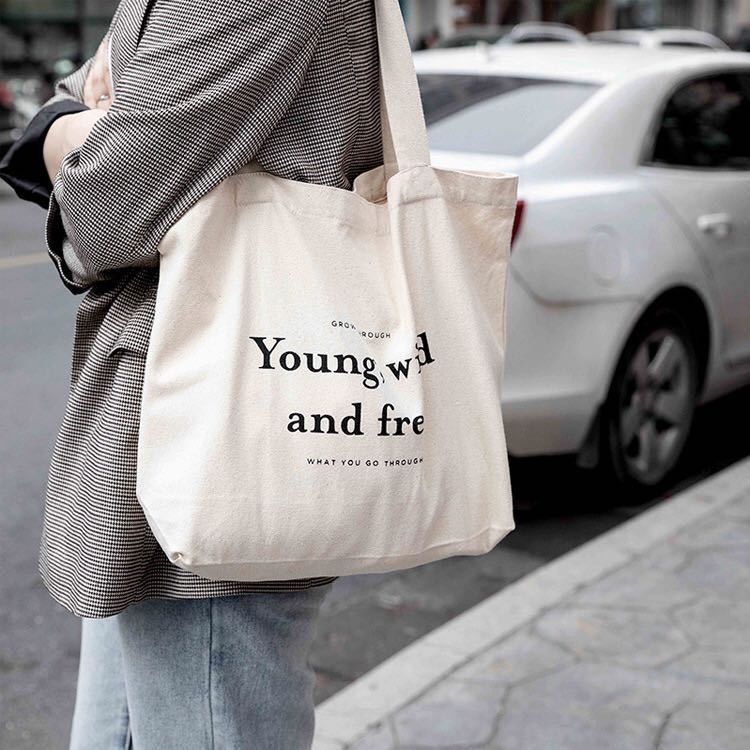 Sacs à dos en coton de couleur personnalisés avec style manipulé et logo de l'entreprise imprimé